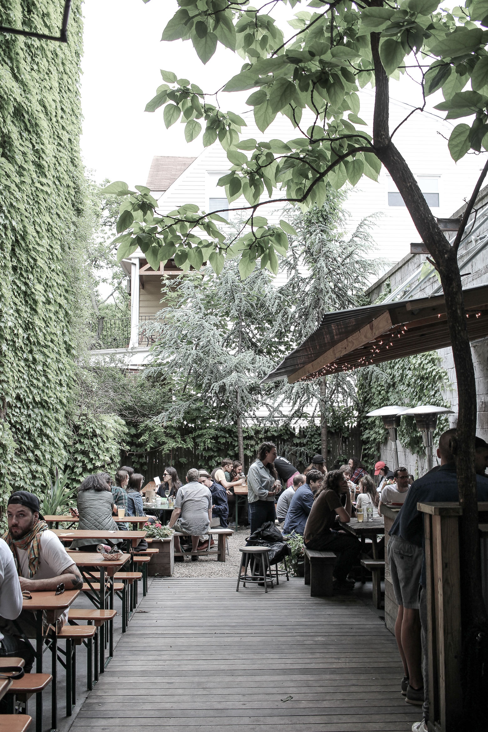 the backyard of a bar with customers