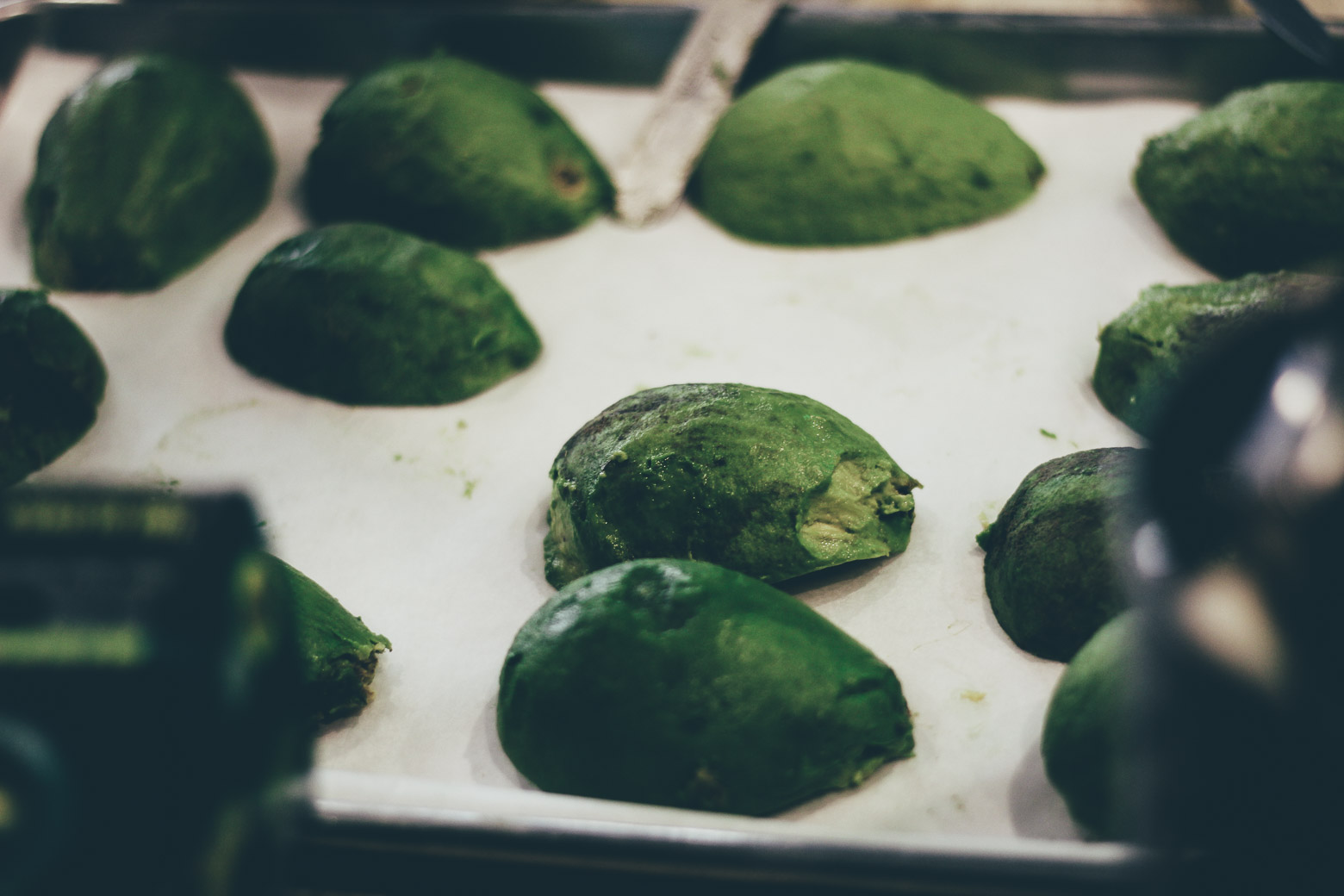 sliced avocados on a tray 